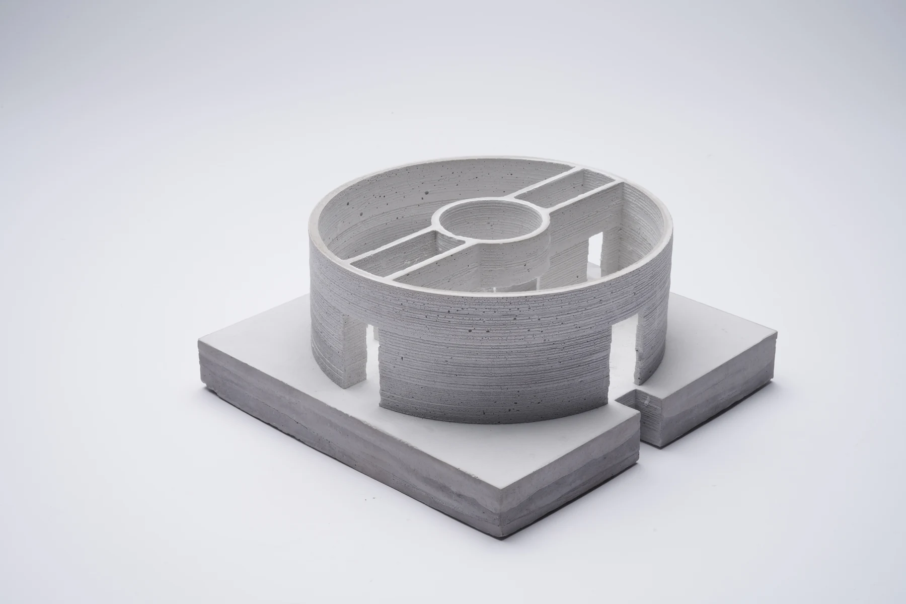 Concrete model of a circular bathing chamber divided into quadrants