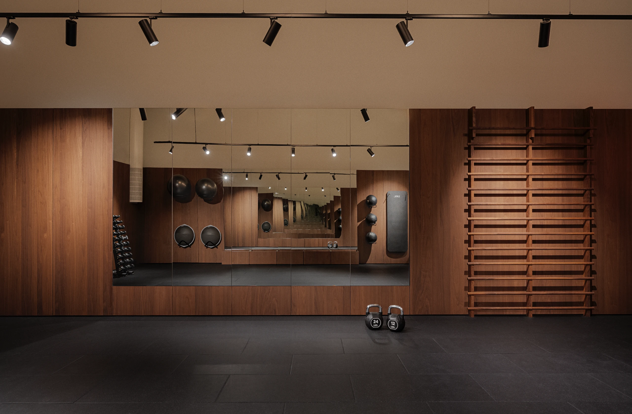 The Charlottehaven Health Club training floor with walnut walls and Swedish wall bars