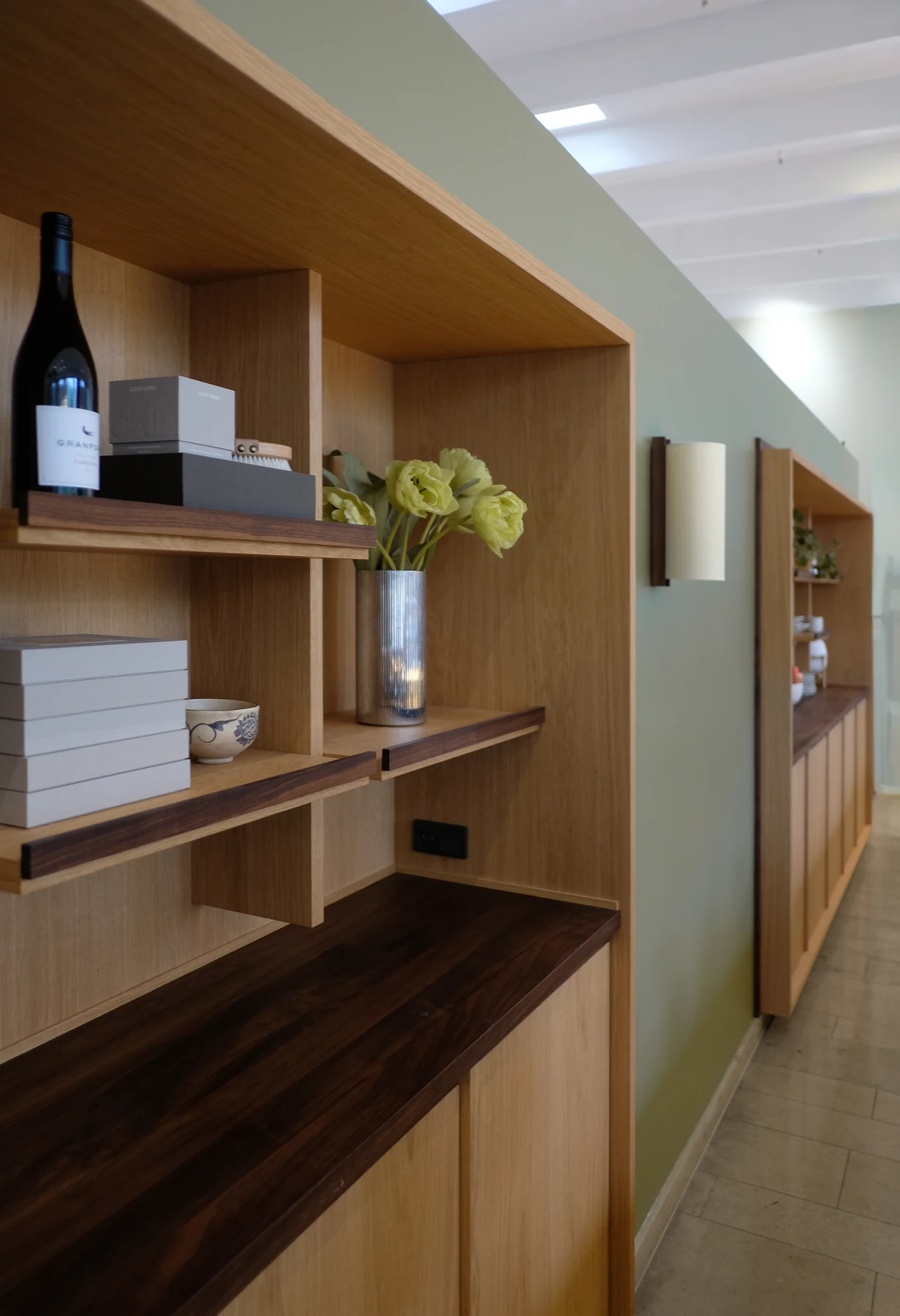 The display shelving running the length of the lobby towards the reception desk