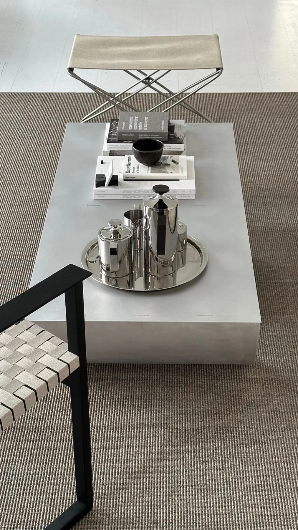 The IB table in a living room, styled with a tray and ceramics